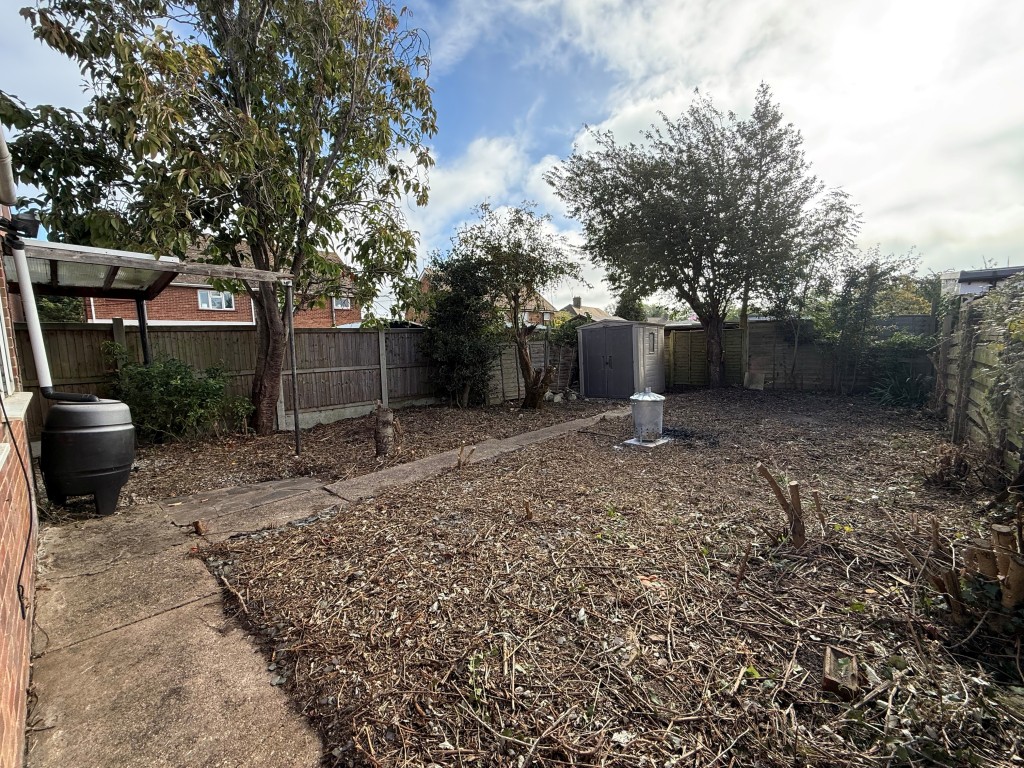 Lot: 163 - THREE-BEDROOM DETACHED HOUSE FOR IMPROVEMENT - Alternative view of garden with shed